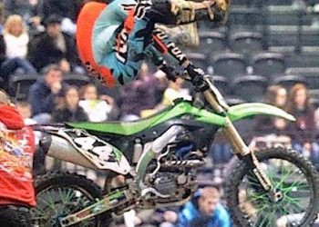 Kyle Hampton, 20, from Prichard, West Virginia throwing up a heel clicker over the finish line in Huntington arena cross finishing in 3rd place with some style! Hampton, whose parents are both deceased says he rides for them each time out...
