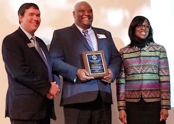 Jeffrey Kennedy (center) was honored Jan. 4 by the by the state, receiving the Commonwealth of Kentucky Martin Luther King Jr. State Commission Adult Leadership Award.