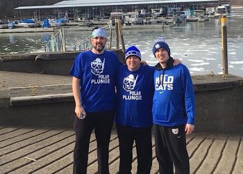 Lawrence Vinson, Mitch Castle, and George Salyers jump into the frozen water at Yatesville lake with temperatures at -1 degrees to raise money for Louisa United Methodist Church's 'Night to Shine'