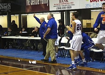 The Tolsia bench erupts as the Rebels tie the game in the second overtime.
