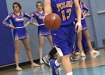 Senior Jared Switzer a four year player for Tolsia bringing to ball up the court in his last game.
