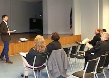 Kentucky Power’s Jacob Colley outlines guidelines for Kentucky Power’s economic development grant programs on Monday in Louisa. This year will be the last for KEAP applications, while the K-PEGG program funded in partnership with commercial and industrial customers will continue. LAWRENCE CO. SCHOOLS CHIEF DR. ROB FLETCHER IS SEATED IN THE PHOTO.