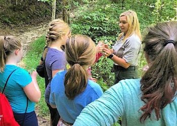 Army Corps of Engineers Natural Resources specialist Kayla Price works with a group of students