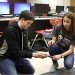 Students at Ashland Middle School demonstrate how to pick up used needles with the device they invented. (Photo by Will Wright Lexington Herald Leader)