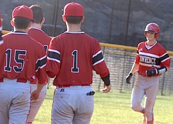 Peyton Cyrus is greeted by his teammates after hitting his third home run of the year Wednesday night at Floyd Central.