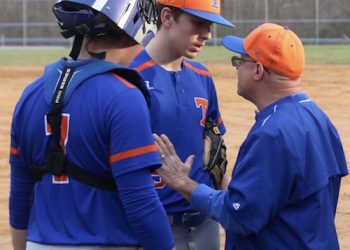 First year Tolsia Head Coach Jeff Wallace talking to pitcher Austin Bailey and catcher Trey Smith in a recent game.