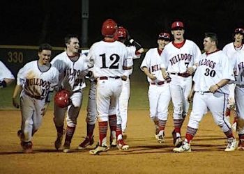 The Dawgs celebrate with #21 Austin Roe after his game winning hit Friday night at Home.