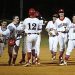 The Dawgs celebrate with #21 Austin Roe after his game winning hit Friday night at Home.