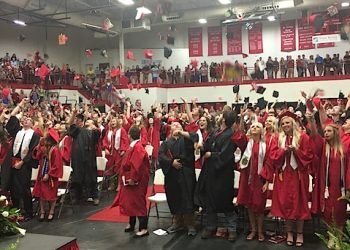 The 'mortar boards' went flying when dismissal was declared last Friday.