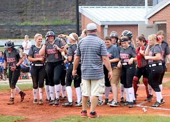 #6 Ciana Bowen is all smiles as her team greets her after hitting a Grand Slam in the Lady Bulldogs District opening victory.