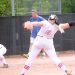 LC's Ciana Bowen strides toward the plate for one of her 11 k&rsquo;s vs Paintsville as former LCHS baseball coach Randy Keeton, now coaching Girls Softball at Paintsville, looks on.