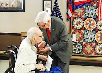 Congressman Hal Rogers pins a medal on Albert Patrick.