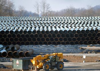 Along U.S. Route 19 in southern West Virginia, row after row of pipe is stockpiled in preparation for construction of the 300-mile Mountain Valley Pipeline, one of several major natural gas pipelines that will crisscross the state as the industry booms.