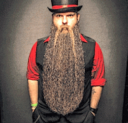 Lance Wooton, of Lily, shows off four years growth of his 25 inch beard. He now travels the world competing in beard competitions.