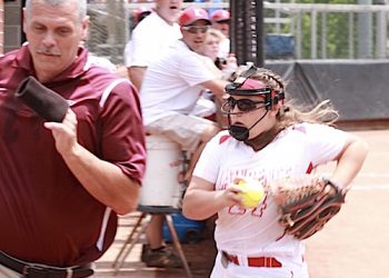 Mackenzie Methax makes a running catch in foul territory as the Pikeville first base coach tries to avoid contact.