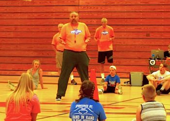 Lady Rebel Head Coach Ric Morrone talking to the kids during a short break Thursday at the Rebel Pride Camp
