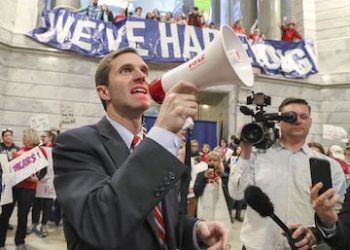 Attorney General Andy Beshear speaks to the crowd as hundreds of teachers from school districts around Kentucky rallied in Frankfort on Friday morning after pension reform legislation was pushed through on Thursday night. March 30, 2018 (Photo: Michael Clevenger/Louisville Courier Journal