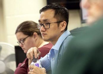 Epidemiologist Rui Zhao meets with others at Louisville Metro Health and Wellness. (Courier Journal photo by Marty Pearl)
