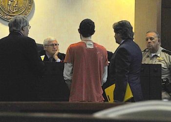 Floyd County Circuit Judge Thomas Smith asks Robert Powers questions during an Aug. 9 hearing. Powers is scheduled to stand trial next month for shooting a police officer. Photo by Mary Meadows