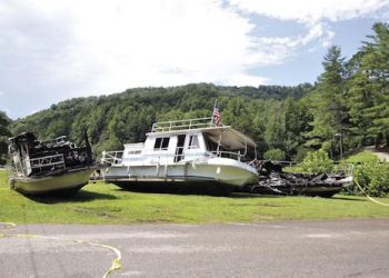 These three house boats were destroyed and two others were damaged in a fire that occurred after midnight on Aug. 8 at Jenny Wiley State Resort Park. Floyd Chronicle and Times photo by Mary Meadows