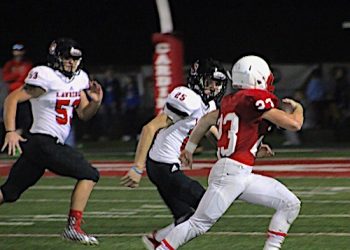 DAWGS WIN DISTRICT OPENER AT SHELDON CLARK