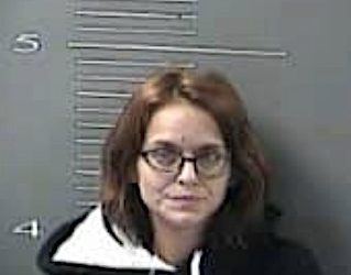 MOTHER PASSED OUT BEHIND THE WHEEL WHILE TWO KIDS LAY IN FLOORBOARD OF BACK SEAT