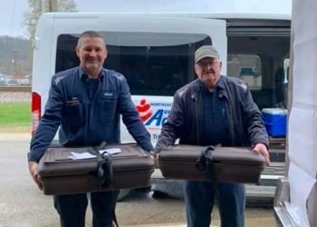 SENIORS SIGNING UP FOR NEW FREE MEALS PROGRAM  IN LOUISA