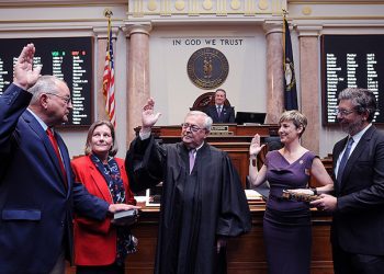 FRANKFORT, March 3 -- Two newly elected representatives were sworn in to the House. Pictured, from left, are Rep. Richard White, R-Morehead, his wife Valerie White, Chief Justice John D. Minton Jr., Rep. Rachel Roberts, D-Newport, and her husband Michael Skrzelowski.