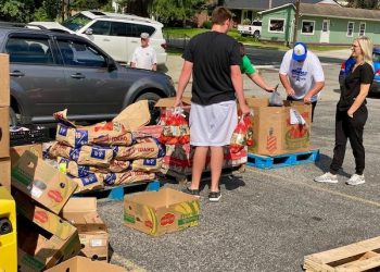 FACING HUNGER FOOD BANK AND OVP HEALTH DISTRIBUTE FOOD TO COMMUNITY MEMBERS