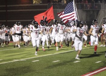 POLLACK TOSSES FOUR TOUCHDOWNS AS DAWGS GET ROAD VICTORY OVER POWELL CO.