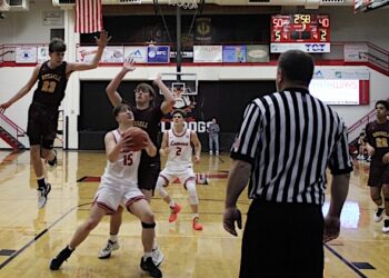 DAWGS USE MUSCLE TO TAKE CARE OF RUSSELL; Huge District game at Home Friday night