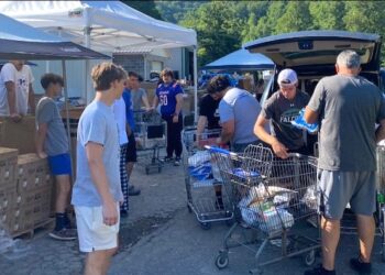 Tolsia Football Puts In Volunteer Work At Dunlow Community Center Food Pantry